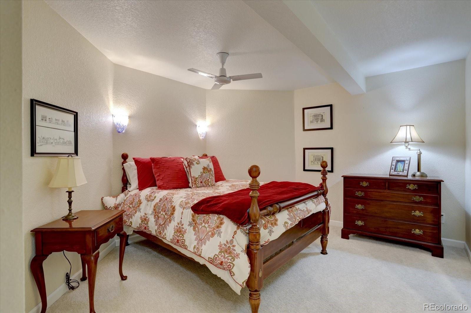 815 16th Street Boulder, CO 80302 - Photo 31 of 47 a spacious bedroom with a bed and a lamp