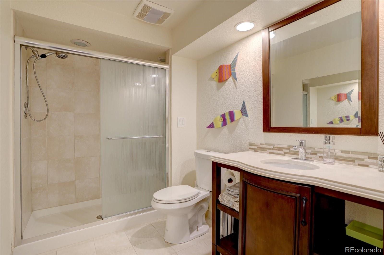 815 16th Street Boulder, CO 80302 - Photo 33 of 47 a bathroom with a sink and a mirror