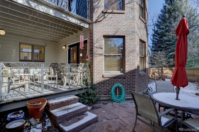 a front view of a house with outdoor seating