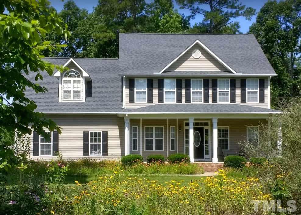 135 Cattle Farm Drive Raleigh, NC 27603 - Photo 1 of 30 front view of house with a yard