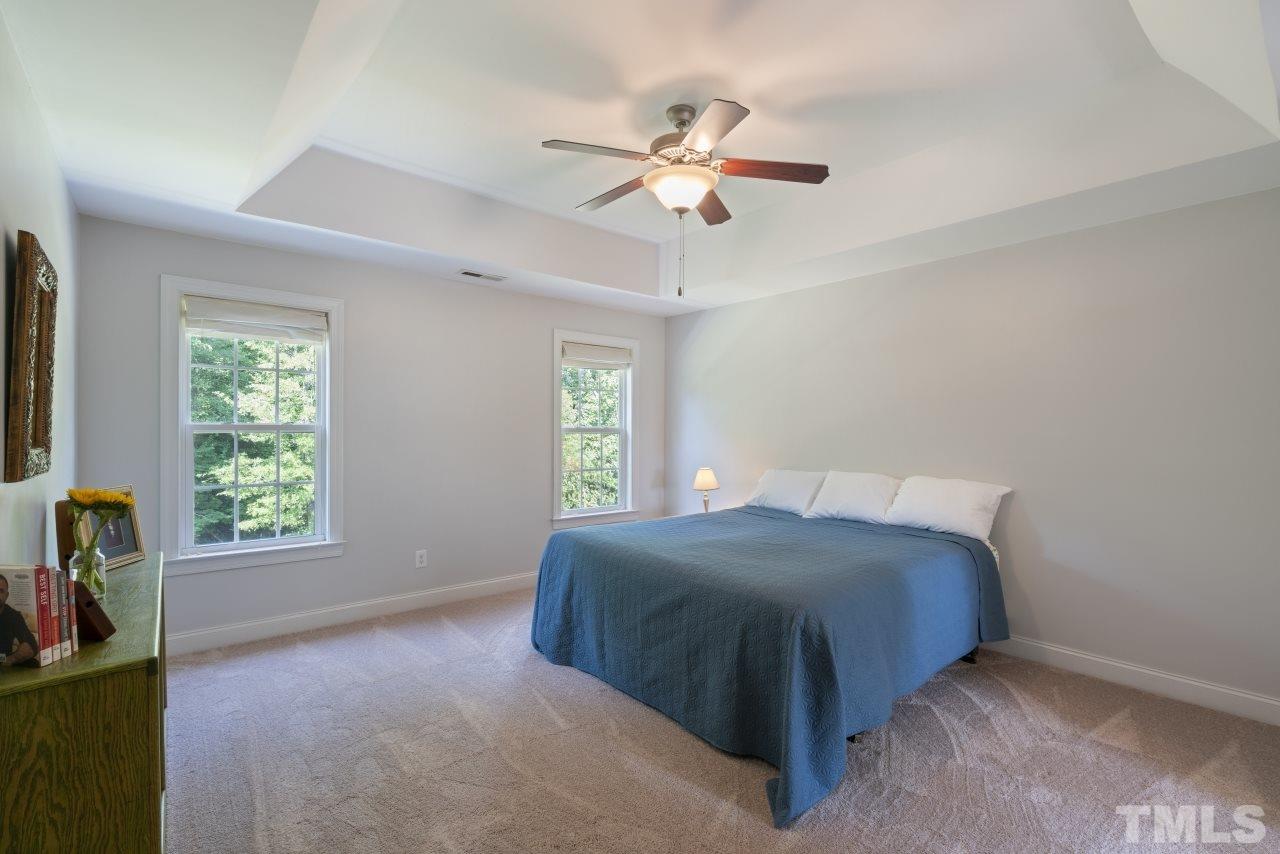 135 Cattle Farm Drive Raleigh, NC 27603 - Photo 15 of 30 a bedroom with a bed and window
