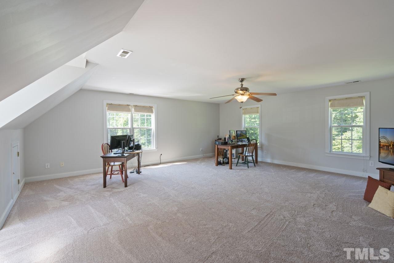 135 Cattle Farm Drive Raleigh, NC 27603 - Photo 23 of 30 a view of a livingroom with furniture and a window