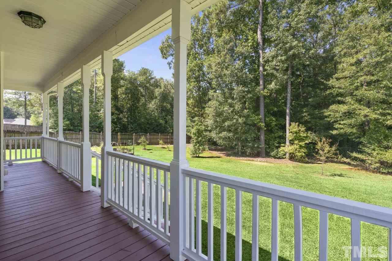 135 Cattle Farm Drive Raleigh, NC 27603 - Photo 25 of 30 a view of a porch with a backyard