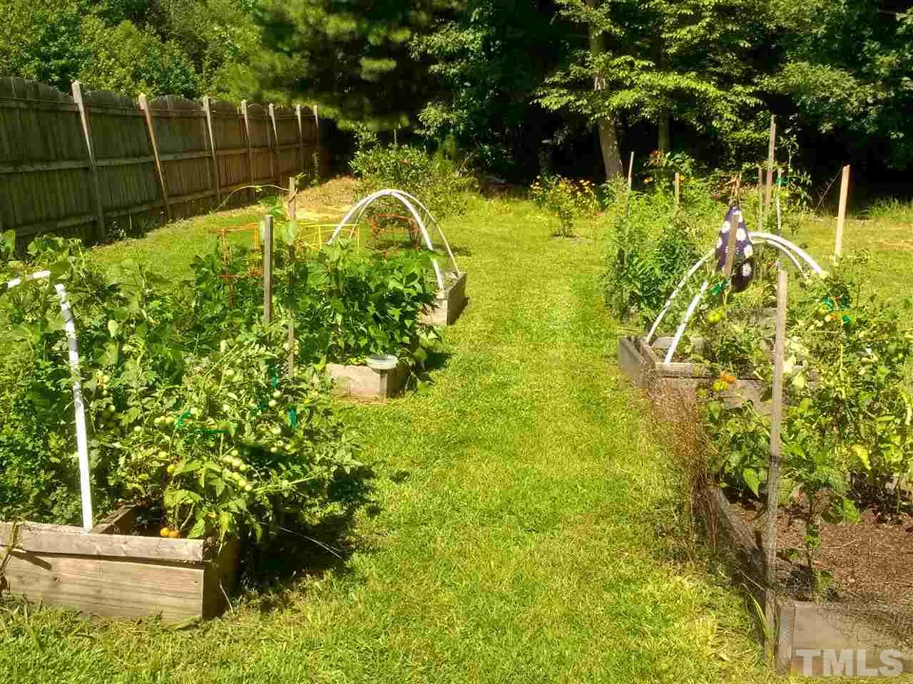 135 Cattle Farm Drive Raleigh, NC 27603 - Photo 26 of 30 a view of a garden