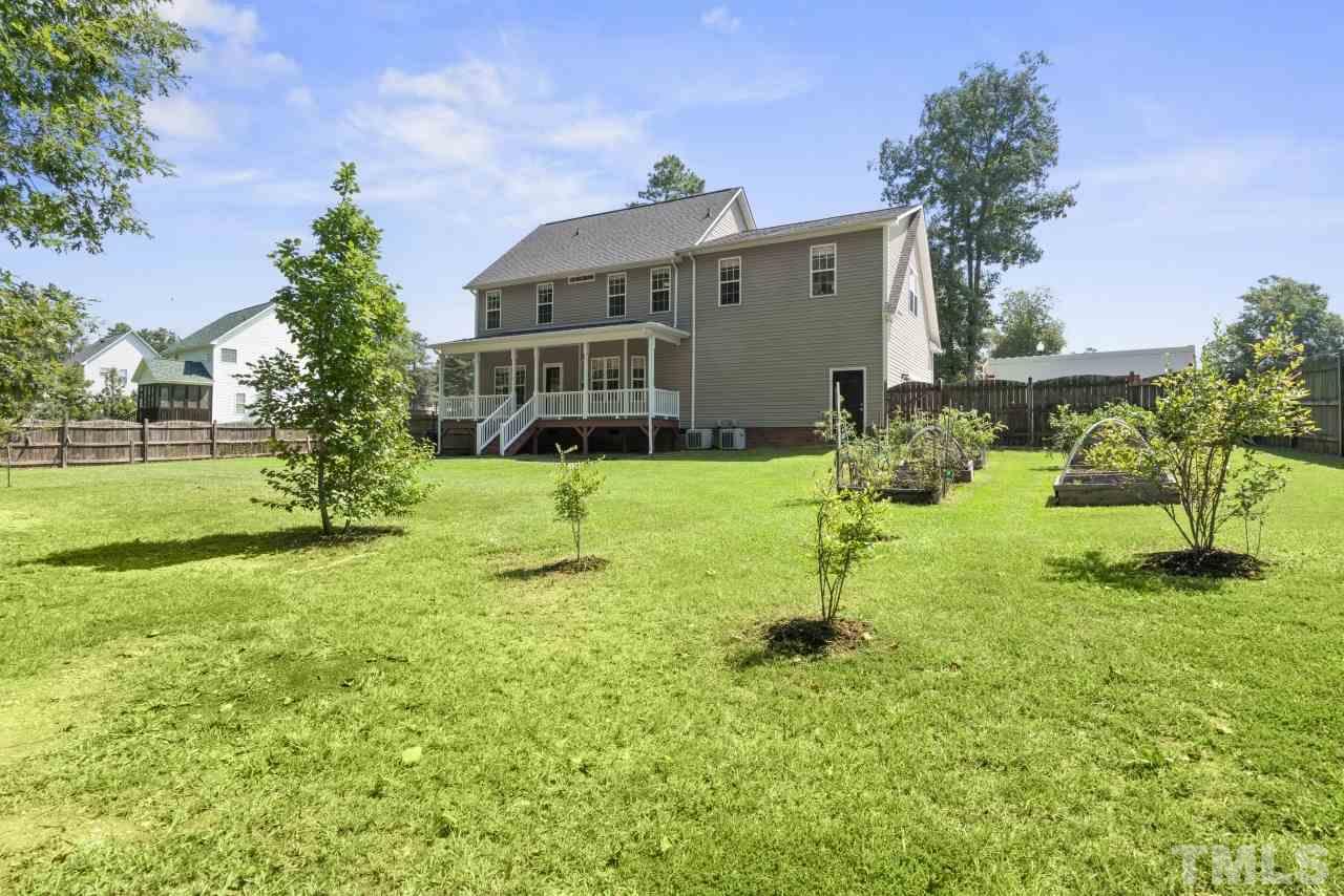 135 Cattle Farm Drive Raleigh, NC 27603 - Photo 30 of 30 a view of a house with a yard