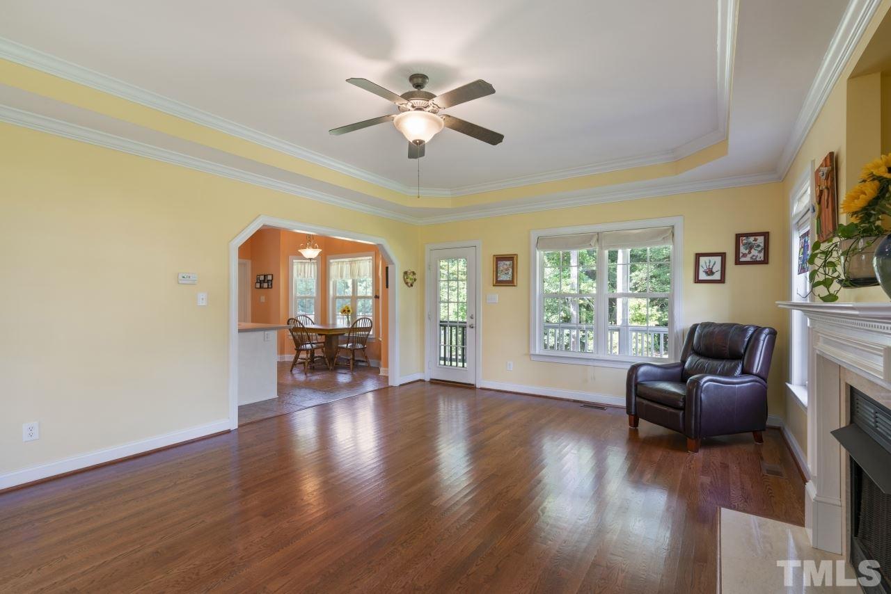 135 Cattle Farm Drive Raleigh, NC 27603 - Photo 6 of 30 a living room with furniture and a wooden floor