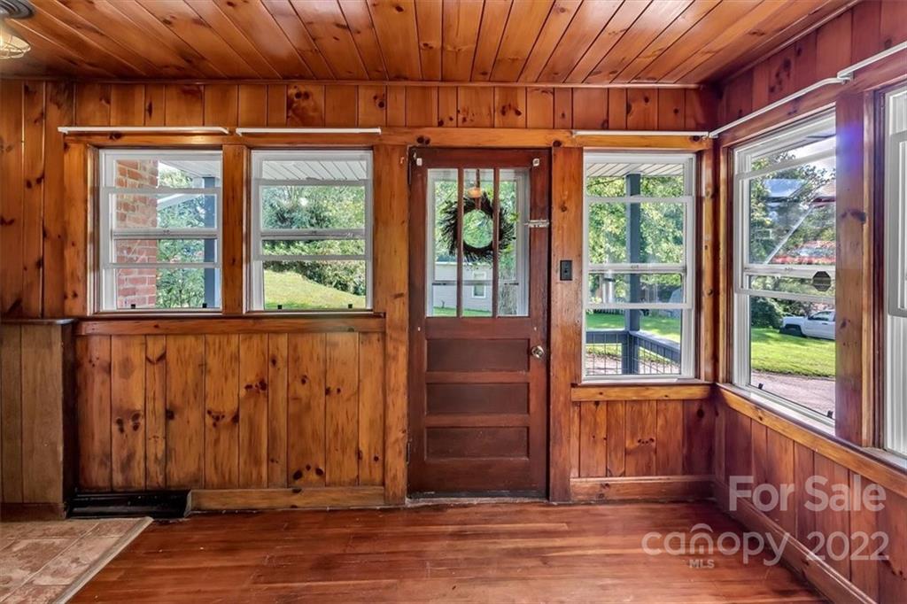 219 Star Ridge Road Canton, NC 28716 - Photo 8 of 27 a view of a room with wooden floor and windows