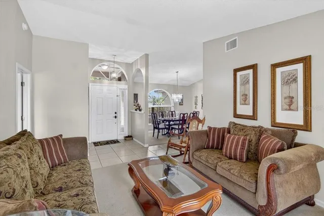 a kitchen with white cabinets and appliances