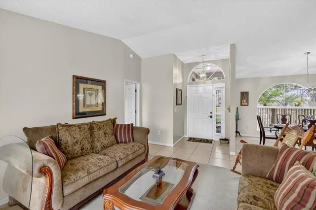a kitchen with white cabinets and appliances