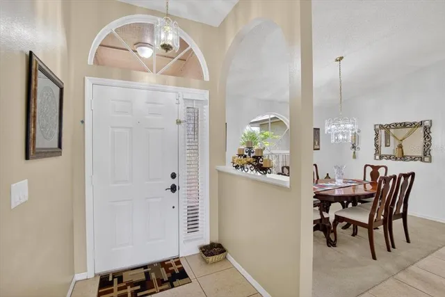 a kitchen with stainless steel appliances granite countertop a sink a stove and a wooden cabinets