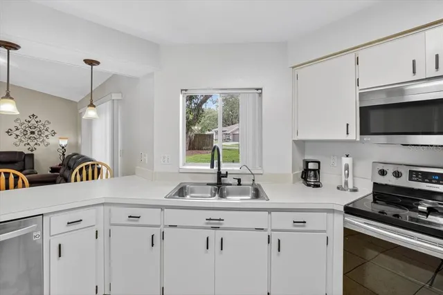 a view of a workspace with furniture