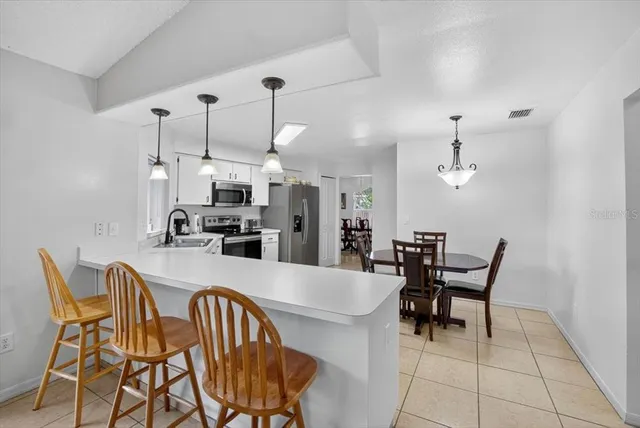 a bathroom with a sink a toilet and bathtub