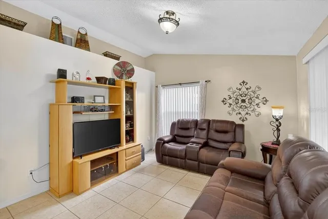 a bedroom with furniture and a book shelf