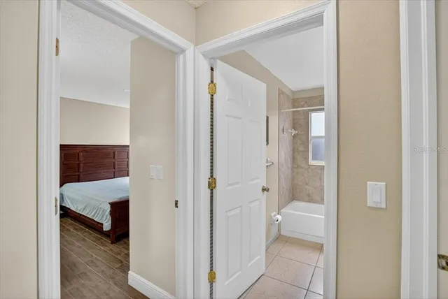 a front view of a house with a yard and a garage