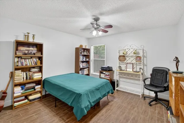 an aerial view of a house with a yard and lake view