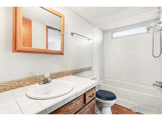 a bathroom with a sink a toilet and a bathtub