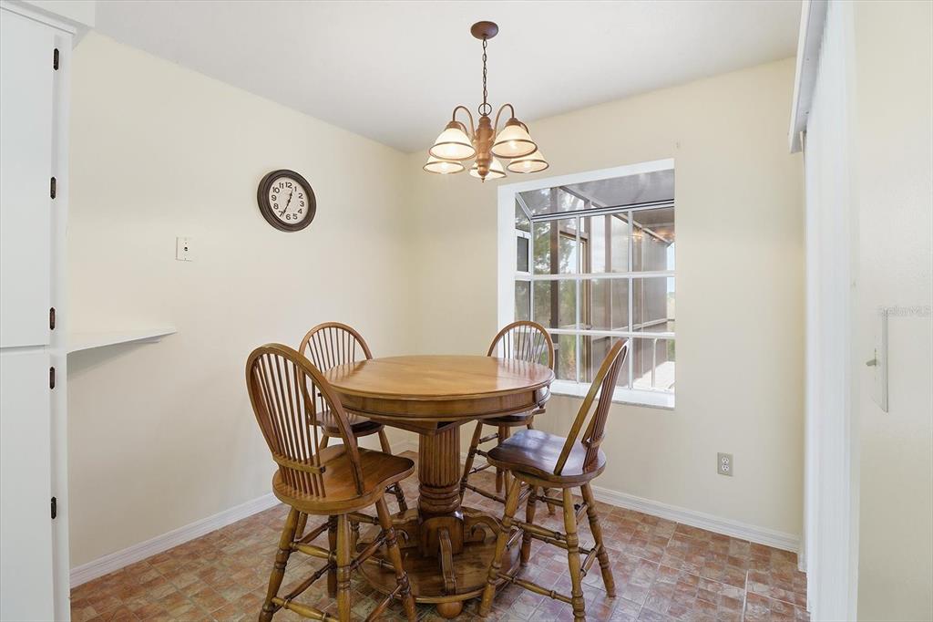 4601 South Gator Loop Homosassa, FL 34448 - Photo 11 of 49 a dining room with furniture and a chandelier