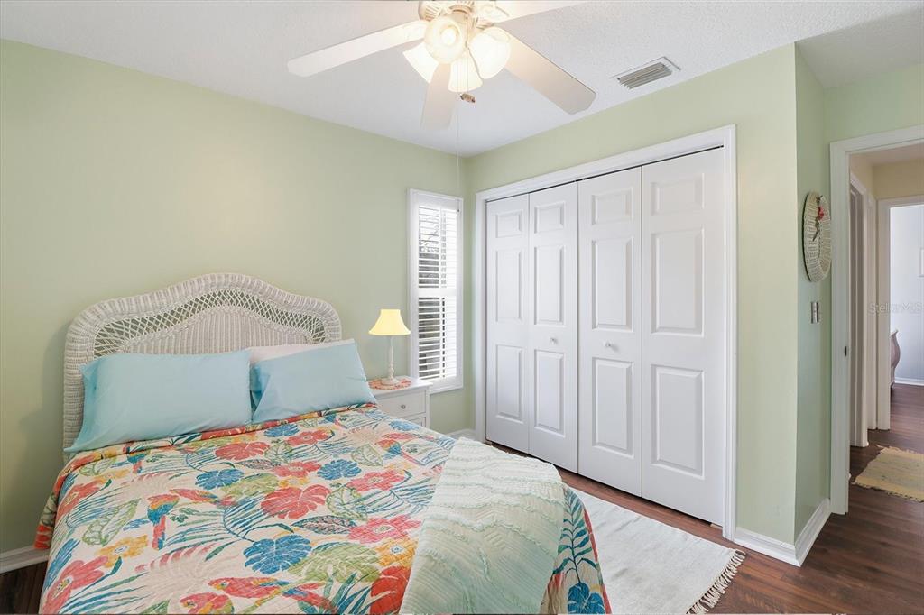 4601 South Gator Loop Homosassa, FL 34448 - Photo 27 of 49 a bedroom with a bed and a chandelier