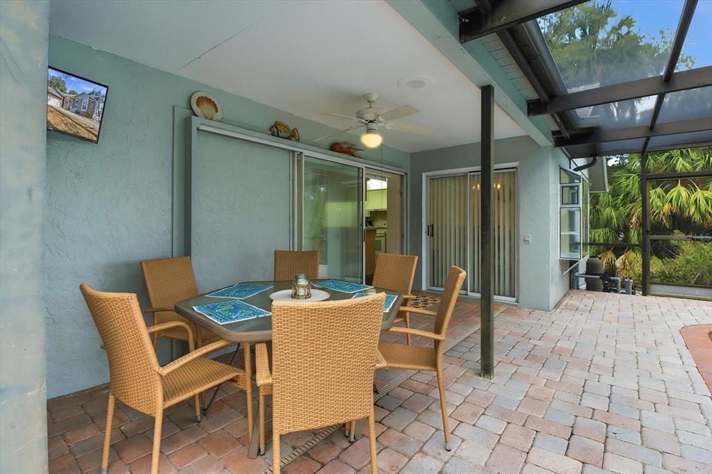 4601 South Gator Loop Homosassa, FL 34448 - Photo 33 of 49 a patio with a table and chairs