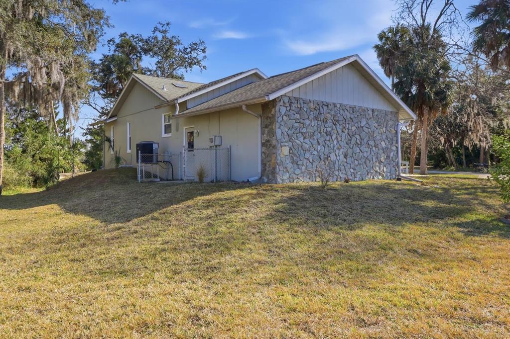 4601 South Gator Loop Homosassa, FL 34448 - Photo 36 of 49 a front view of a house with a yard and garage