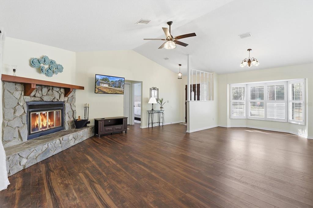 4601 South Gator Loop Homosassa, FL 34448 - Photo 4 of 49 a view of an empty room with window and wooden floor