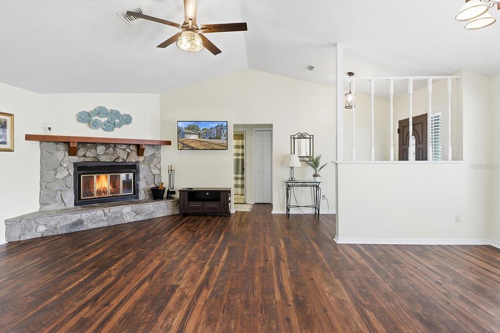 4601 South Gator Loop Homosassa, FL 34448 - Photo 47 of 49 a view of a livingroom with wooden floor and a fireplace