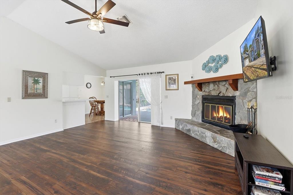 4601 South Gator Loop Homosassa, FL 34448 - Photo 48 of 49 a view of an empty room with wooden floor fireplace and a window