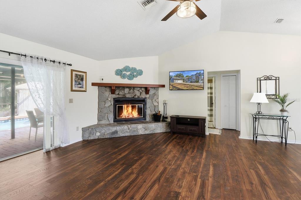 4601 South Gator Loop Homosassa, FL 34448 - Photo 8 of 49 a living room with furniture and a fireplace