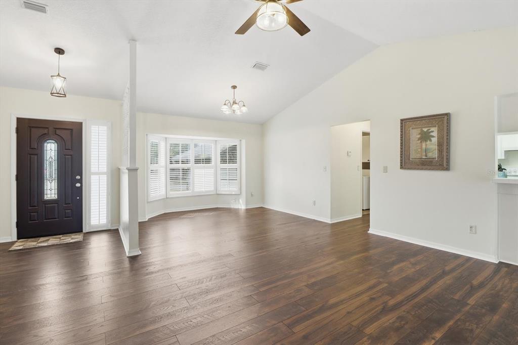 4601 South Gator Loop Homosassa, FL 34448 - Photo 10 of 49 a view of an empty room with window and wooden floor