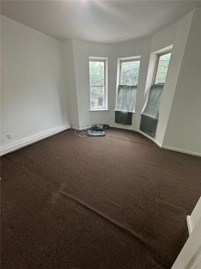 2120 Vyse Avenue, Unit 2 Bronx, NY 10460 - Photo 2 of 7 a view of an empty room with a window