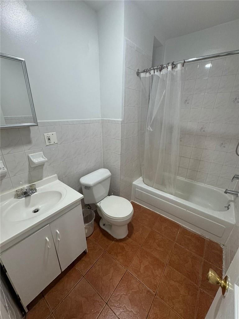 2120 Vyse Avenue, Unit 2 Bronx, NY 10460 - Photo 4 of 7 a bathroom with a sink a toilet and shower