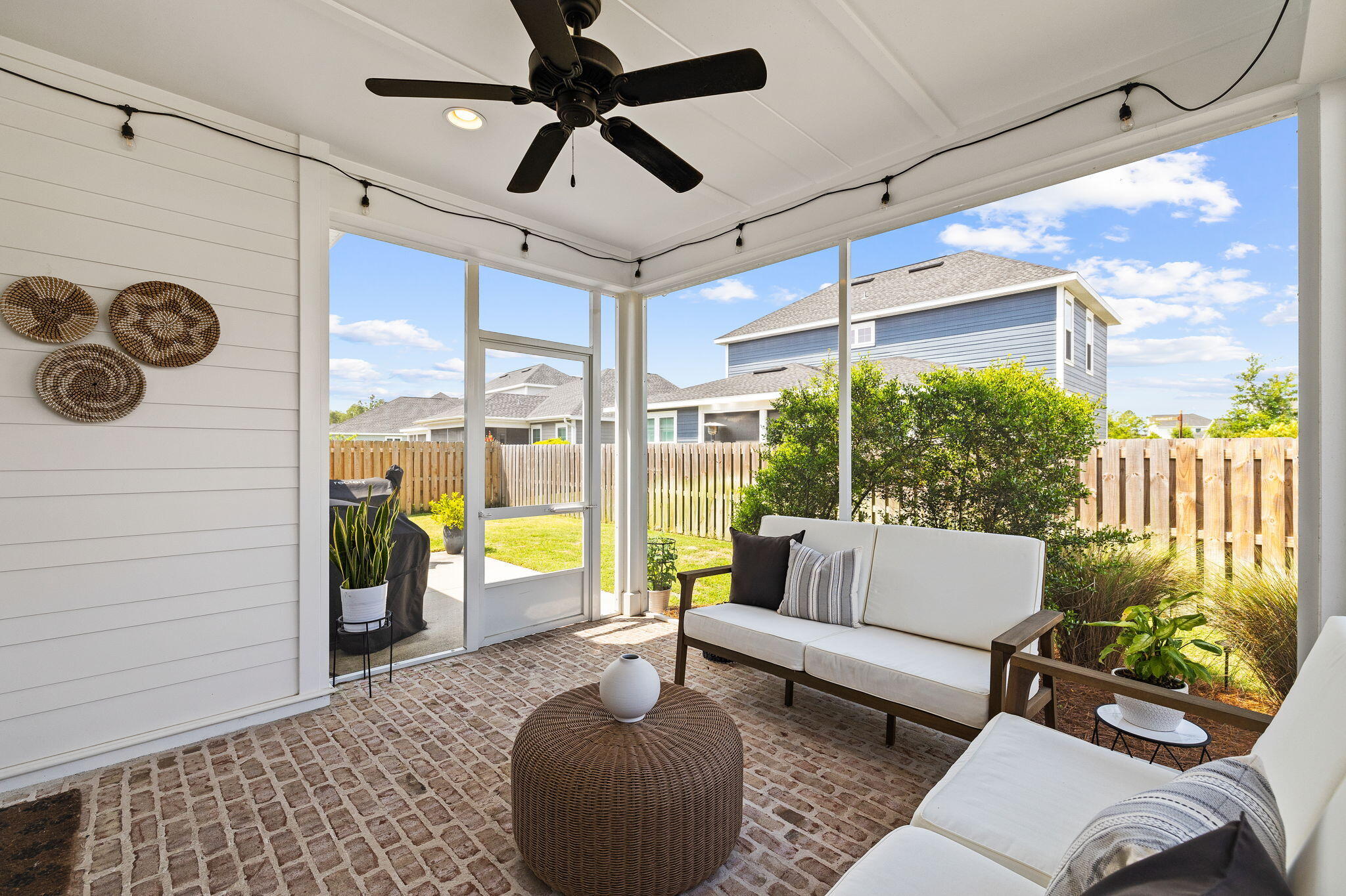 12 Roundwood Dr Inlet Beach Inlet Beach, FL 32461 - Photo 16 of 57 a living room with furniture and a floor to ceiling window