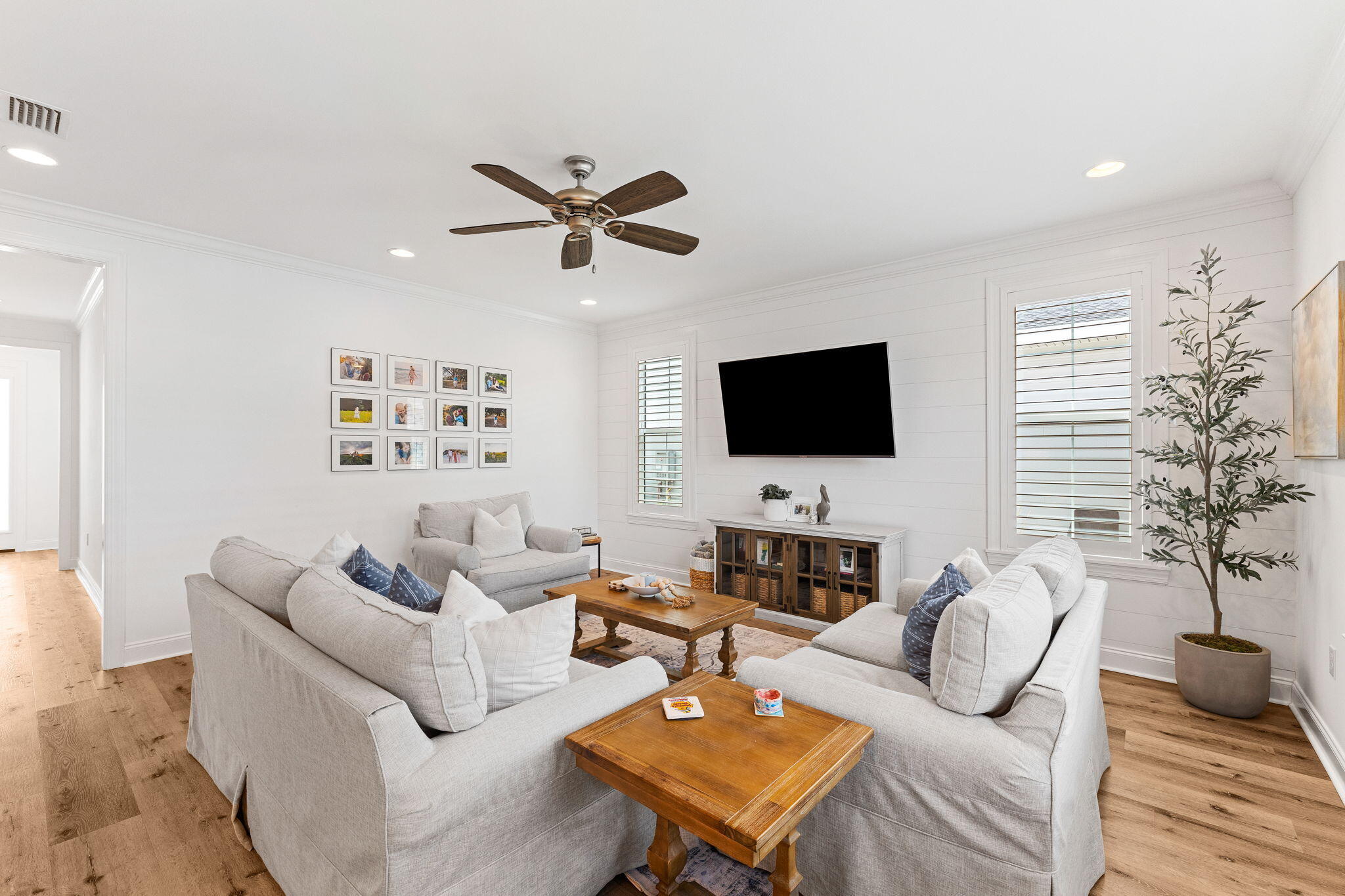 12 Roundwood Dr Inlet Beach Inlet Beach, FL 32461 - Photo 27 of 57 a living room with furniture a flat screen tv and a potted plant
