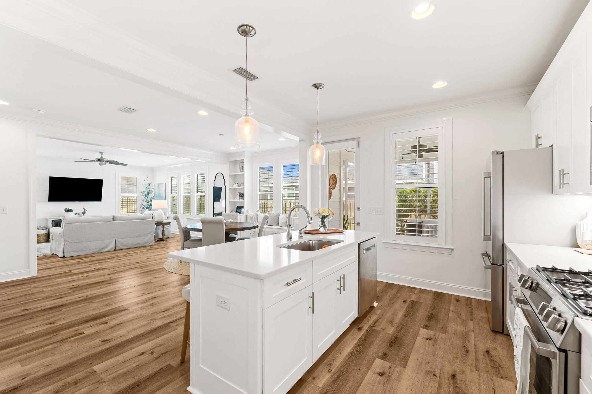12 Roundwood Dr Inlet Beach Inlet Beach, FL 32461 - Photo 38 of 57 a large white kitchen with a large window a sink and a stove top oven