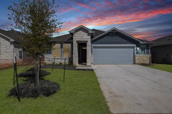 a view of a front of house with a yard