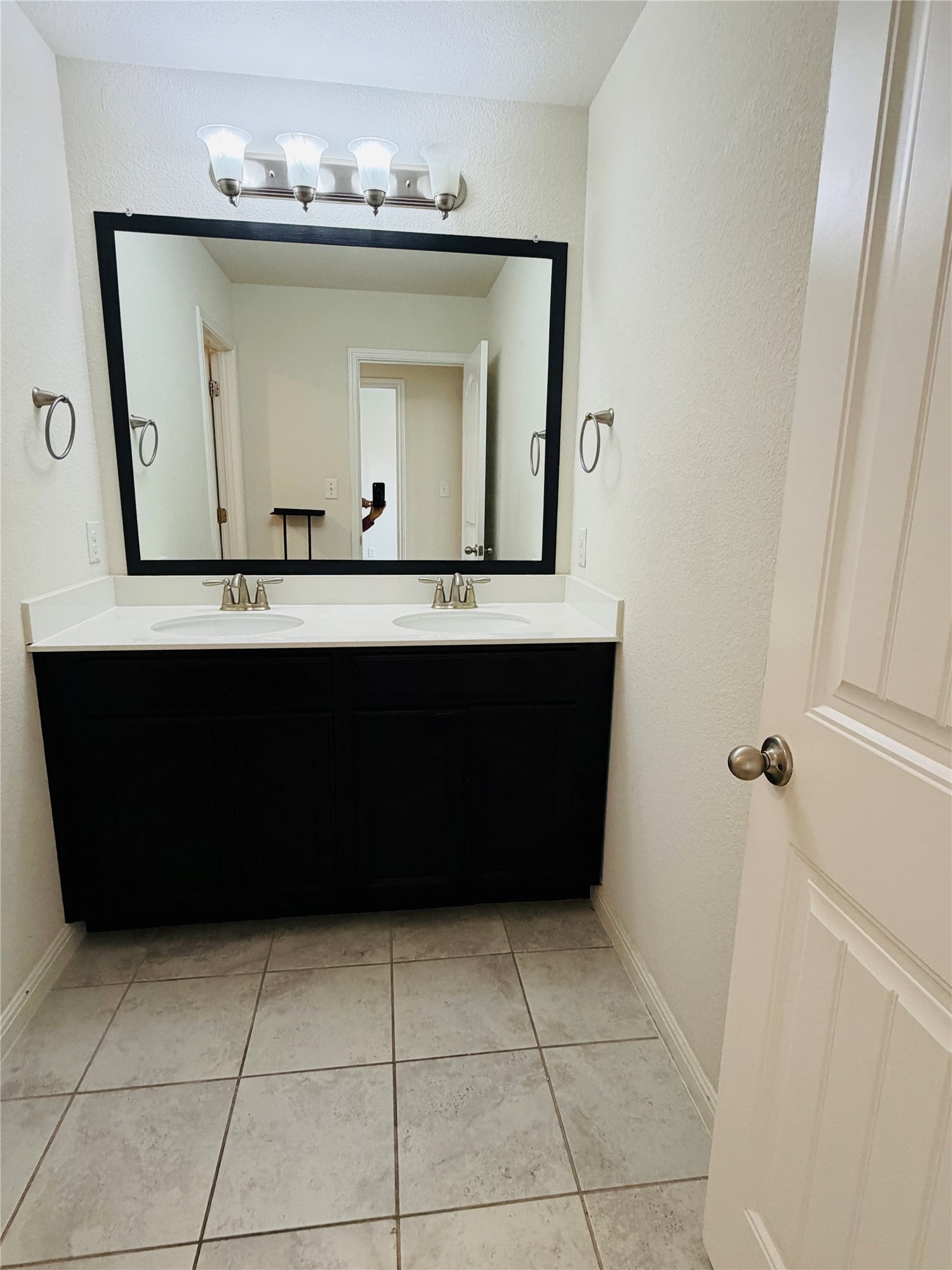 2013 Hat Bender Loop Round Rock, TX 78664 - Photo 9 of 16 Bathroom with double vanity and light tile patterned flooring