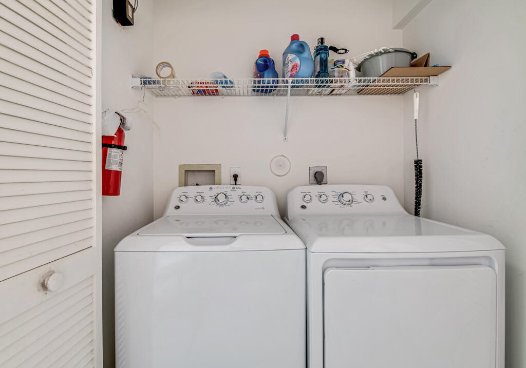 9976 Seacrest Circle, Unit A Boynton Beach, FL 33437 - Photo 15 of 48 a utility room with dryer and washer