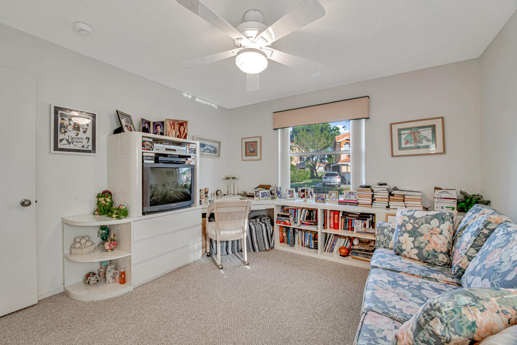 9976 Seacrest Circle, Unit A Boynton Beach, FL 33437 - Photo 25 of 48 a living room with furniture and a large window