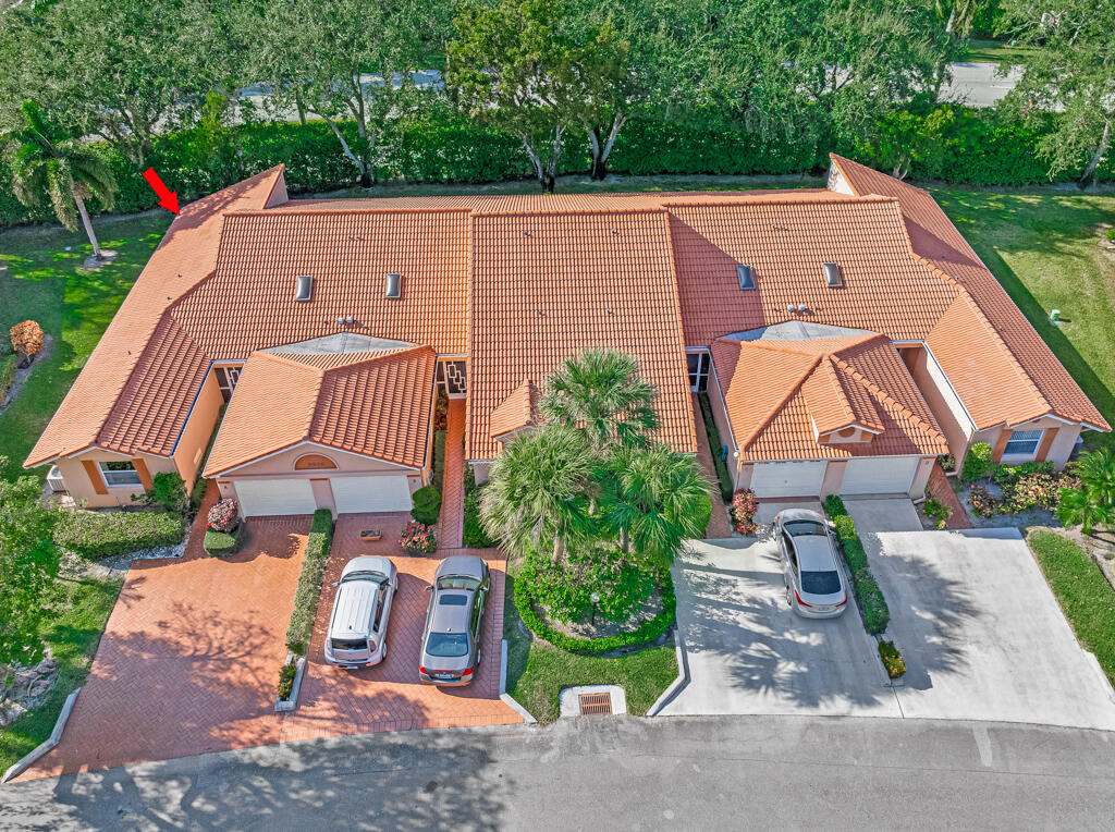 9976 Seacrest Circle, Unit A Boynton Beach, FL 33437 - Photo 29 of 48 an aerial view of a house with garden space and street view