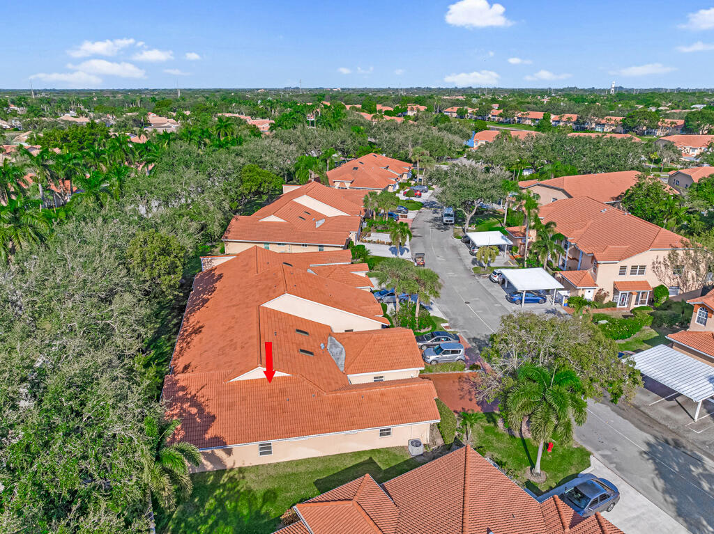 9976 Seacrest Circle, Unit A Boynton Beach, FL 33437 - Photo 31 of 48 an aerial view of a house with a garden