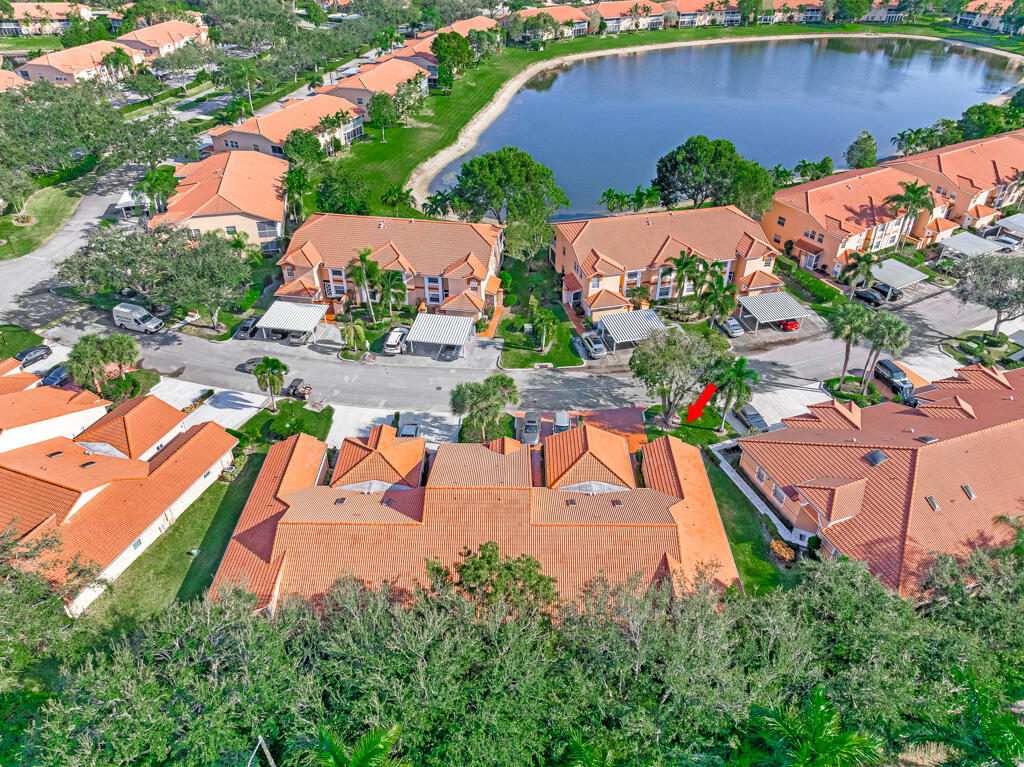 9976 Seacrest Circle, Unit A Boynton Beach, FL 33437 - Photo 34 of 48 an aerial view of a house with a garden and lake view