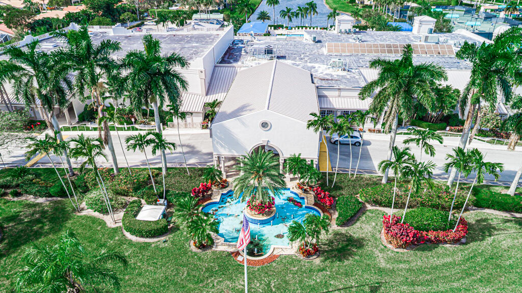 9976 Seacrest Circle, Unit A Boynton Beach, FL 33437 - Photo 39 of 48 a view of a flower in a yard with potted plants