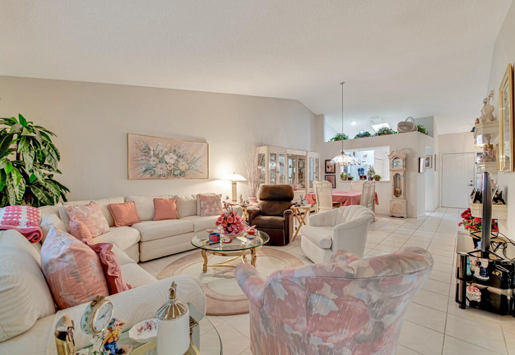 9976 Seacrest Circle, Unit A Boynton Beach, FL 33437 - Photo 5 of 48 a living room with furniture and a couch