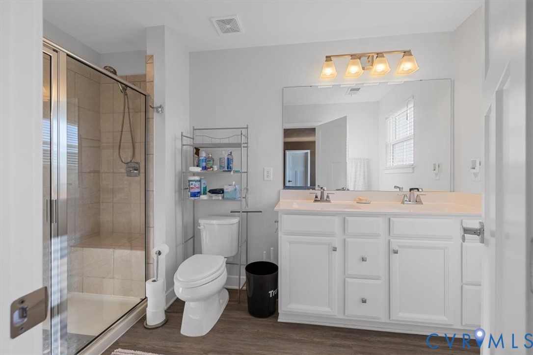 9002 Spring Green Loop Mechanicsville, VA 23116 - Photo 13 of 47 Full bathroom with double vanity, a stall shower,