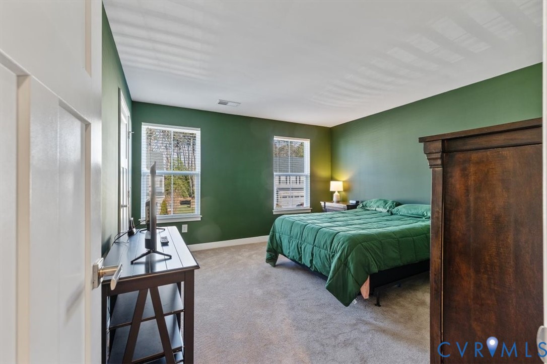 9002 Spring Green Loop Mechanicsville, VA 23116 - Photo 15 of 47 Carpeted bedroom featuring baseboards