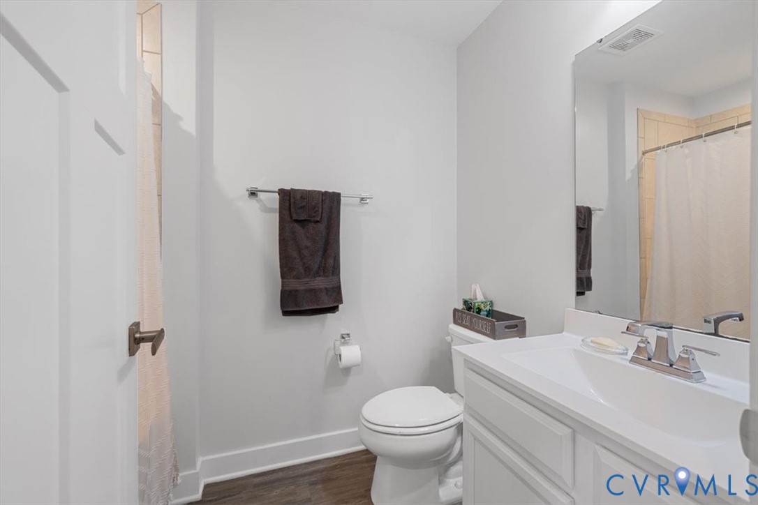 9002 Spring Green Loop Mechanicsville, VA 23116 - Photo 17 of 47 Bathroom featuring a shower with shower curtain, v