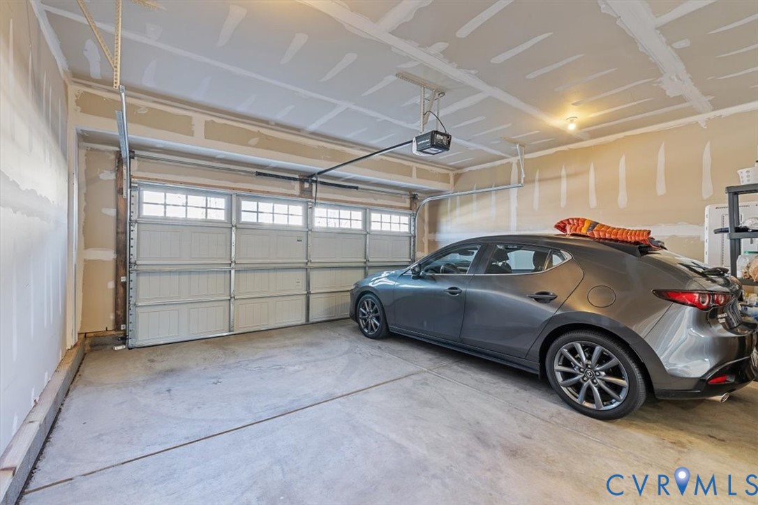 9002 Spring Green Loop Mechanicsville, VA 23116 - Photo 20 of 47 Garage featuring a garage door opener