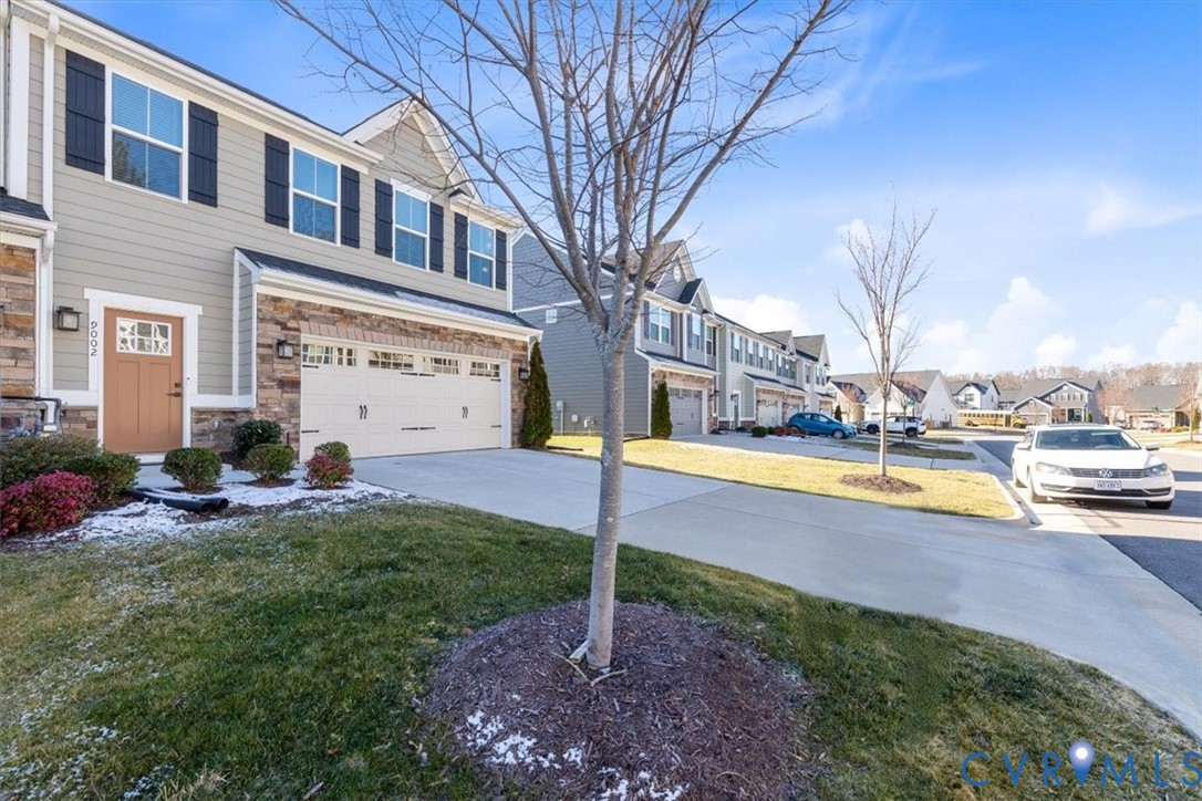 9002 Spring Green Loop Mechanicsville, VA 23116 - Photo 21 of 47 View of green lawn featuring a residential view, c