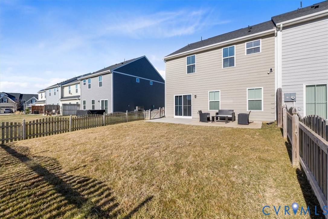 9002 Spring Green Loop Mechanicsville, VA 23116 - Photo 25 of 47 Back of property featuring a patio area, a fenced