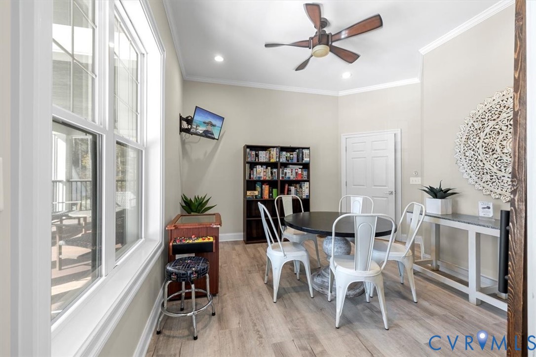 9002 Spring Green Loop Mechanicsville, VA 23116 - Photo 39 of 47 Dining room with crown molding, light wood-type fl